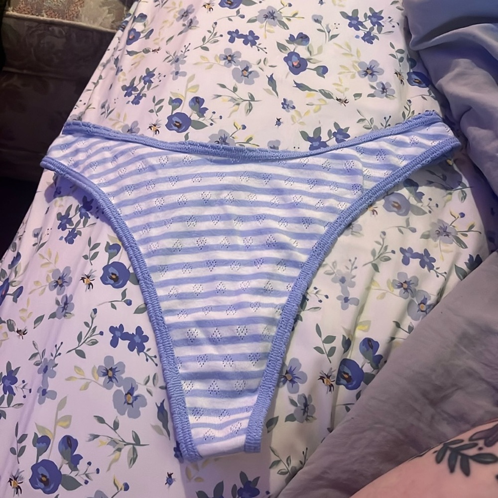 Pink thong panty size M. Blue and white stripes